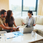 Realtor explaining Quebec closing costs to a couple