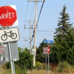 Image of a sign saying "arrêt" in Quebec